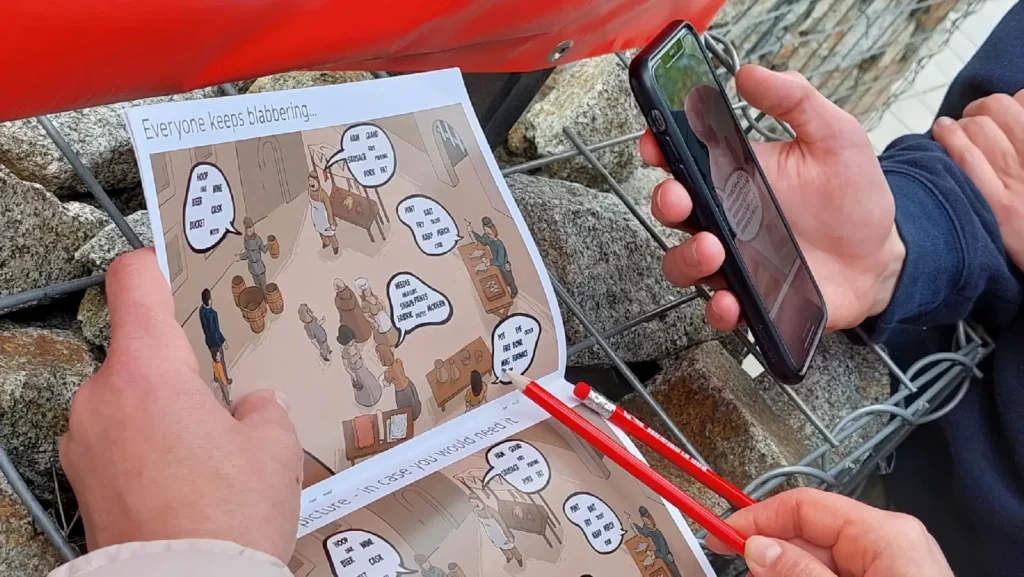 Účastníci riešia úlohy v mestskej šifrovacej hre – teambuilding pre veľké tímy s využitím mapy a mobilu